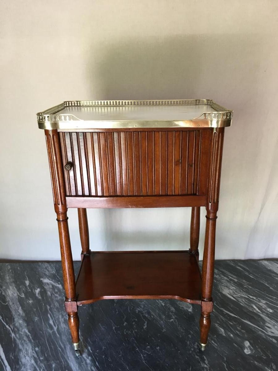 Louis XVI mahogany side table photographed against a plain studio backdrop